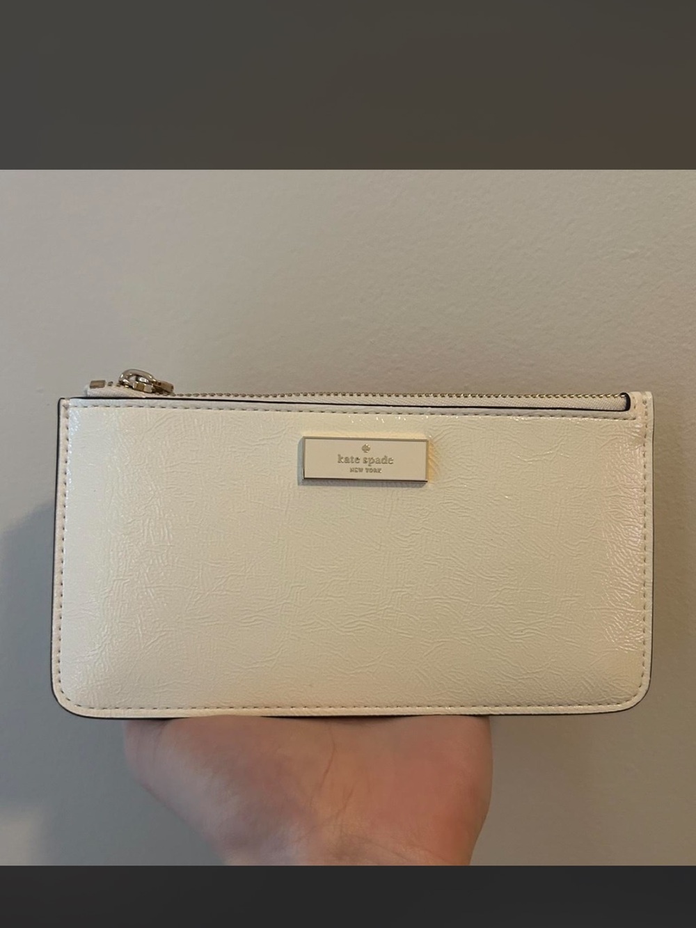 kate spade cream leather zip wallet with gold plaque